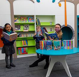 Housebuilder’s donation helps fill school’s library